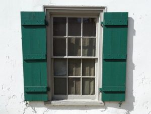 hurricane shutters vs impact windows